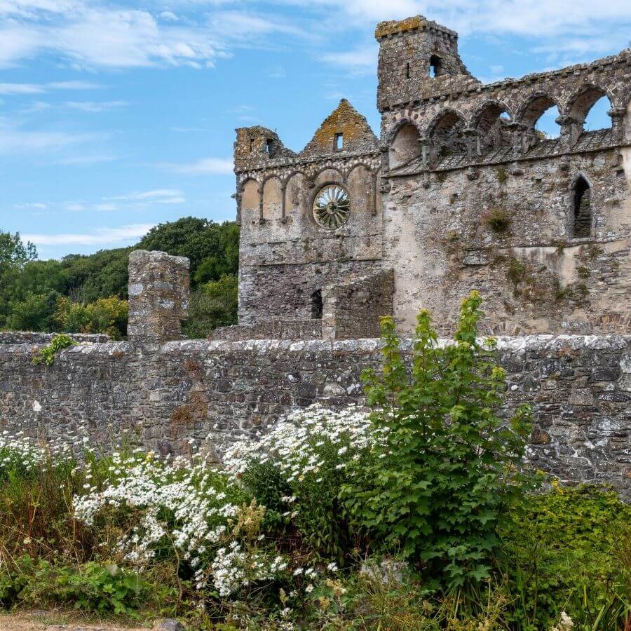 The medieval Bishop's Palace beside St Davids Cathedral, surrounded by the peaceful Cathedral Valley and historic Welsh pilgrimage landscape.